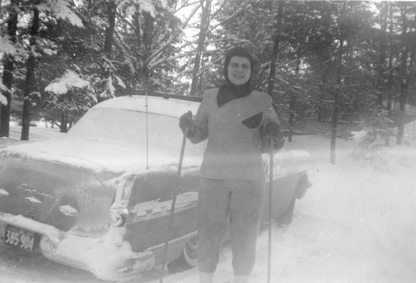 Woodville-born Leola Brintnell poses with skis in front of her car, circa 1957. Leola Brintnell fonds (2023.107), Kawartha Lakes Museum & Archives.