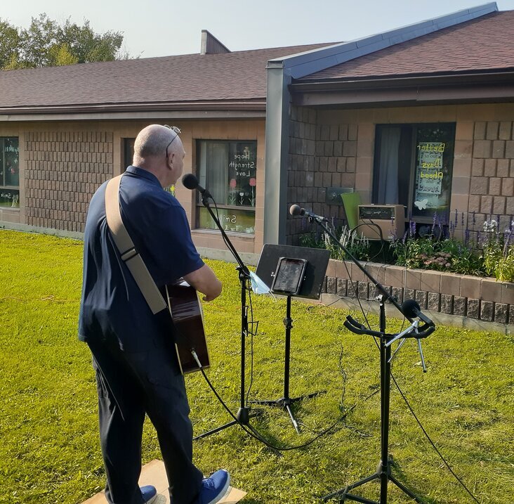 Schroter strums to appreciative audience – on other side of wall