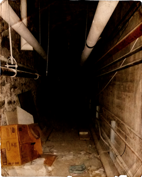 This stone-lined tunnel links a maintenance closet at the west end of the Academy Theatre with the green room, beneath the stage, in the east. Photo: Ian McKechnie.