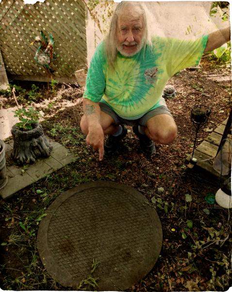 Rick Harding points to an escape hatch he salvaged from the old Dominion Arsenals site. The hatch covered an emergency exit from tunnels which once connected various buildings on the arsenal property. Photo: Ian McKechnie.