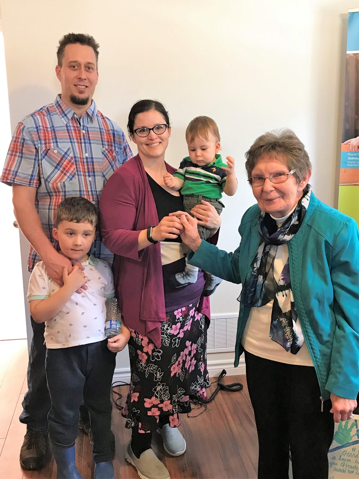 Two Lindsay families receive keys to new Habitat homes
