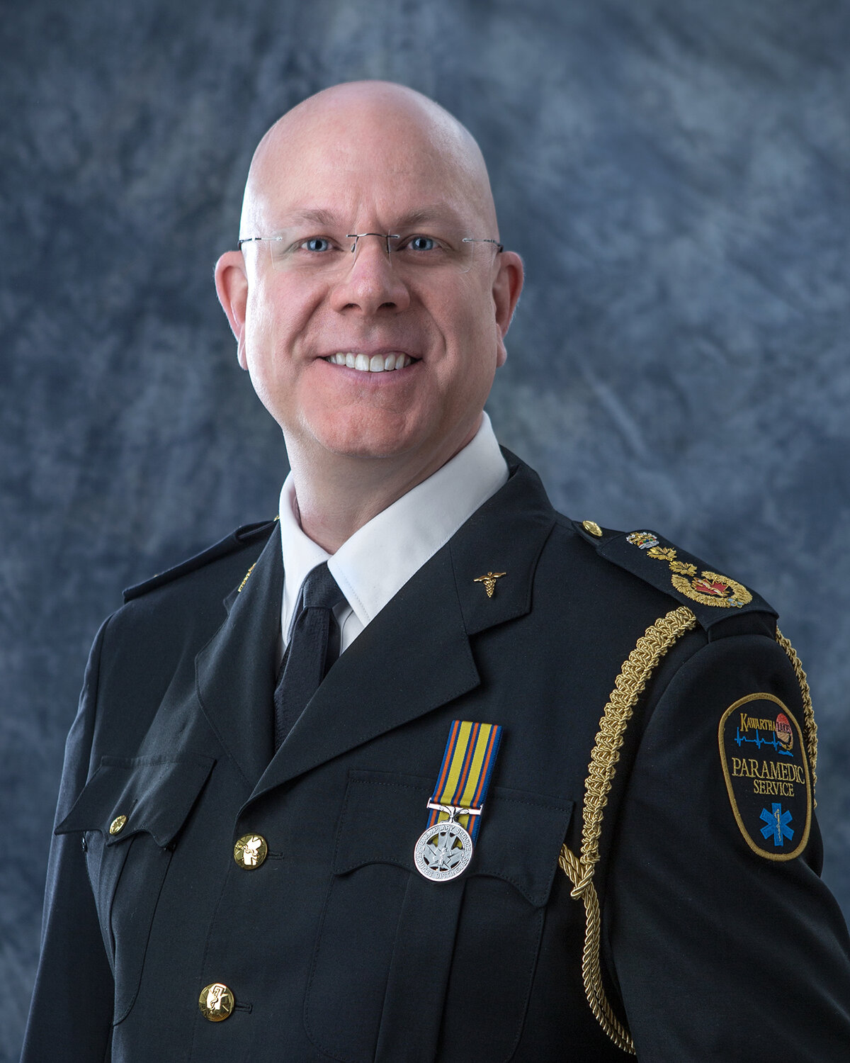 Former paramedic chief charged with fraud after investigation