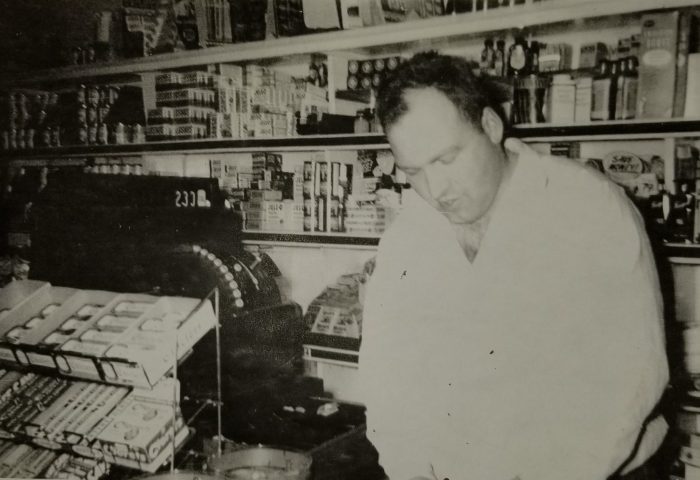 Ross Fisher Sr. at the counter of Fisher's Grocery Store in January of 1956. Photo courtesy of Wally Nugent.