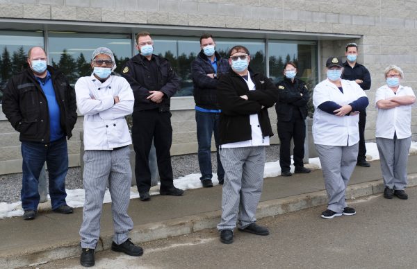 Nine union members standing outside of the Central East Correctional Facility in Lindsay ON